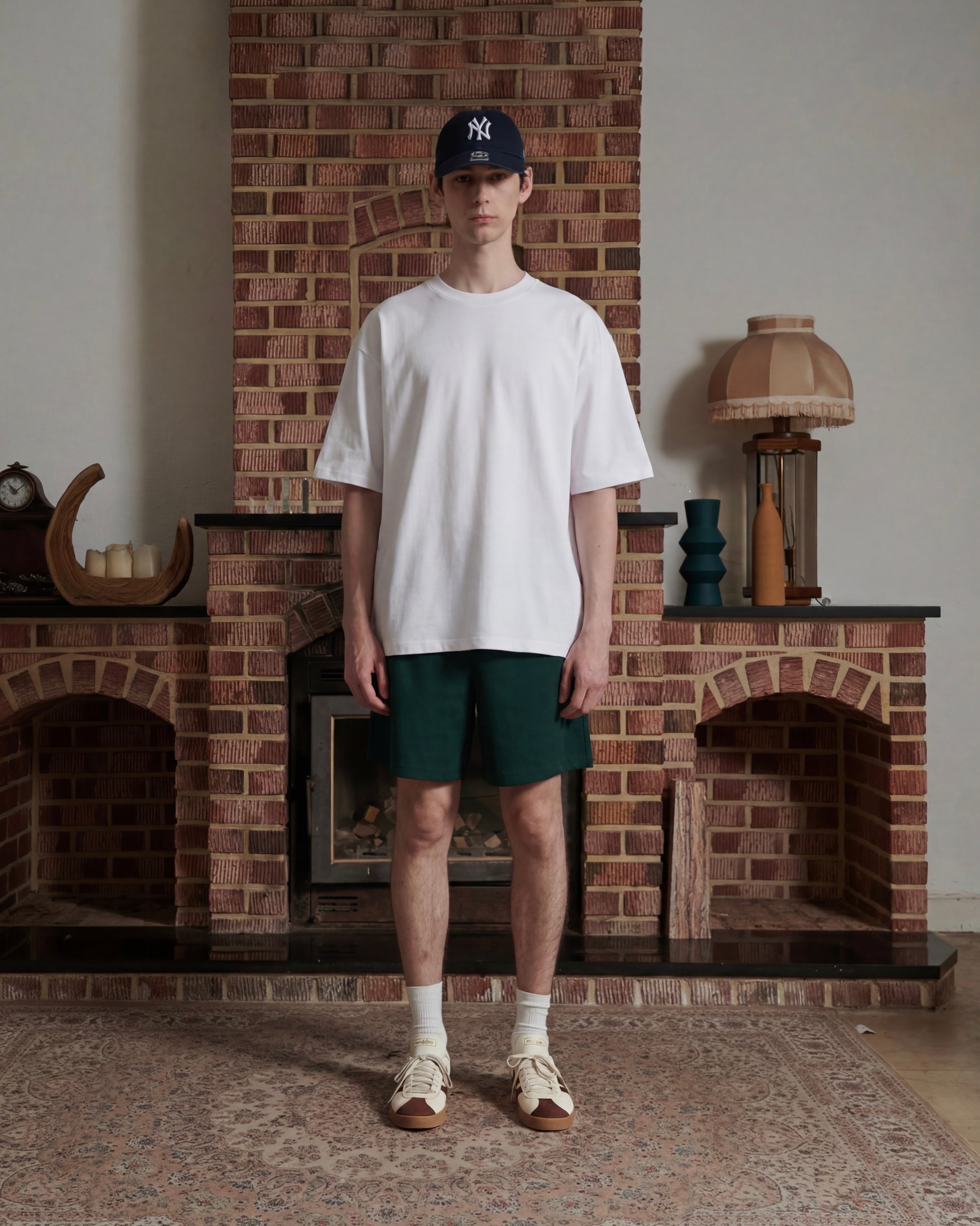 Front facing male wearing white t-shirt