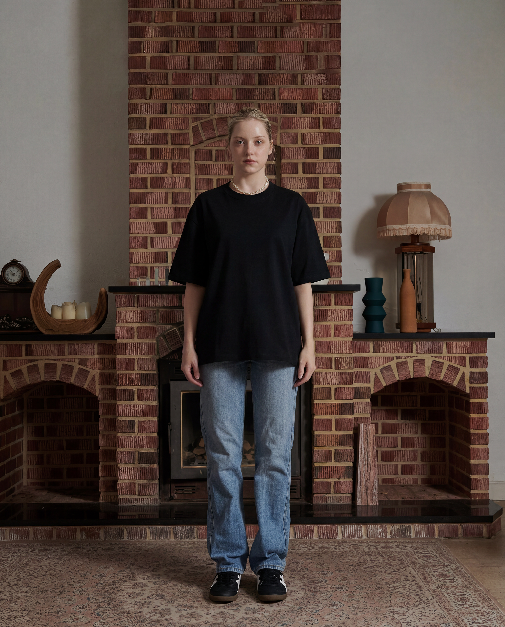 Front facing female wearing black t-shirt